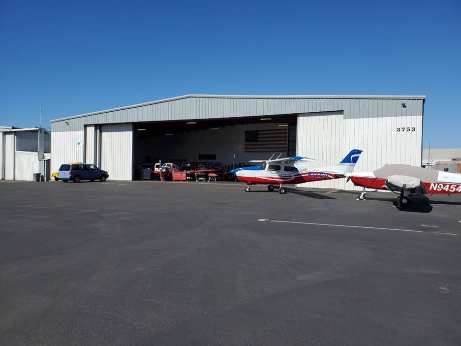 Photo of the Aeromechanix hangar at KMYF (Montgomery Airport)